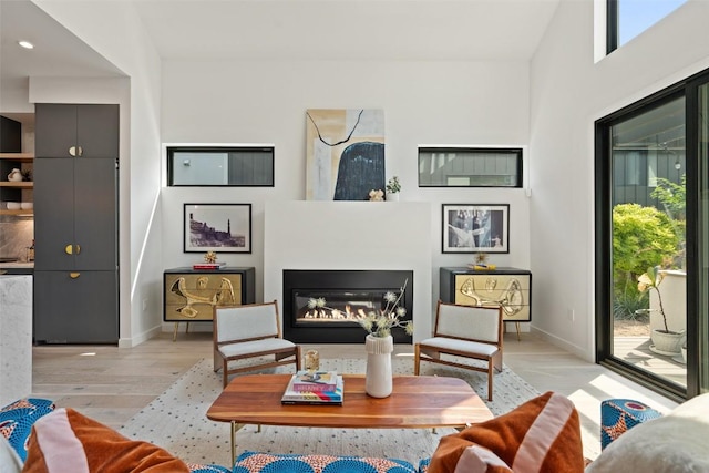 2010 Oxford Ave, Austin, TX 78704 - living area with plenty of natural light, baseboards, wood finished floors, and recessed lighting
