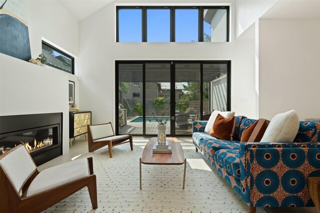 2010 Oxford Ave, Austin, TX 78704 - living room featuring a glass covered fireplace and high vaulted ceiling
