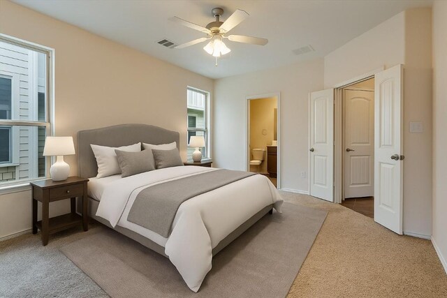 9837 Milla Cir Unit 72, Austin, TX 78748 - bedroom featuring carpet, connected bathroom, ceiling fan, and baseboards