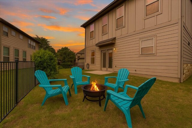 9837 Milla Cir Unit 72, Austin, TX 78748 - patio terrace at dusk with an outdoor fire pit