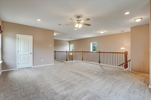 9837 Milla Cir Unit 72, Austin, TX 78748 - carpeted empty room featuring ceiling fan, baseboards, and recessed lighting