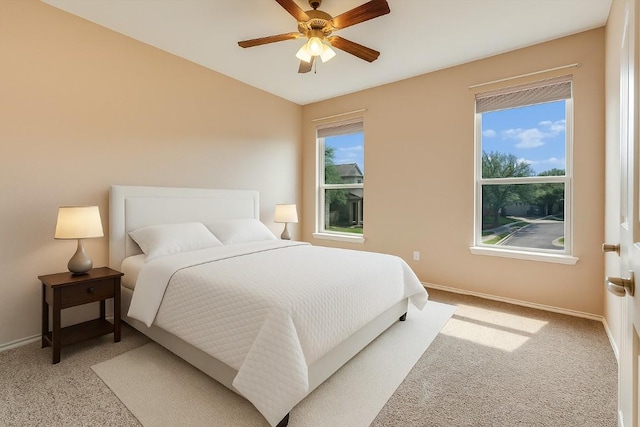 9837 Milla Cir Unit 72, Austin, TX 78748 - bedroom featuring light colored carpet, baseboards, and a ceiling fan