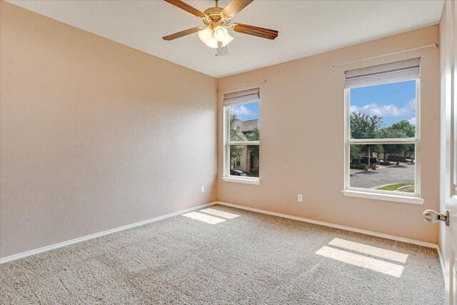 9837 Milla Cir Unit 72, Austin, TX 78748 - carpeted spare room with baseboards and a ceiling fan