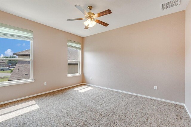 9837 Milla Cir Unit 72, Austin, TX 78748 - carpeted spare room with baseboards and a ceiling fan