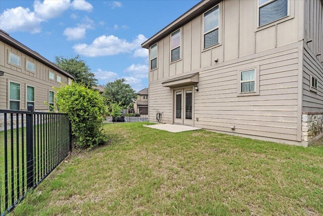 9837 Milla Cir Unit 72, Austin, TX 78748 - rear view of property with board and batten siding and french doors