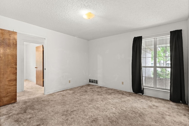 6509 Wagon Wheel Dr, Killeen, TX 76542 - carpeted empty room featuring a textured ceiling