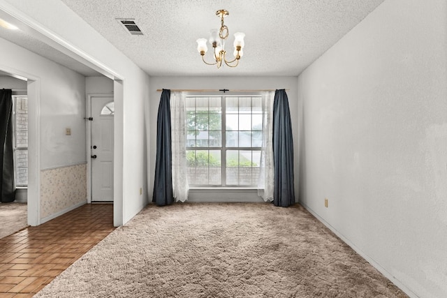 6509 Wagon Wheel Dr, Killeen, TX 76542 - empty room with a chandelier, a textured ceiling, and baseboards