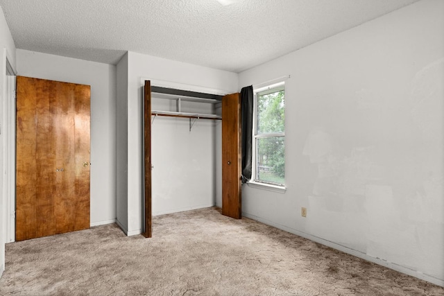 6509 Wagon Wheel Dr, Killeen, TX 76542 - unfurnished bedroom with a textured ceiling, carpet flooring, a closet, and baseboards