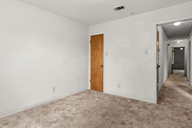 6509 Wagon Wheel Dr, Killeen, TX 76542 - carpeted empty room with a textured ceiling and baseboards