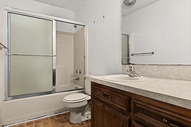 6509 Wagon Wheel Dr, Killeen, TX 76542 - bathroom with vanity, toilet, a textured ceiling, and bath / shower combo with glass door