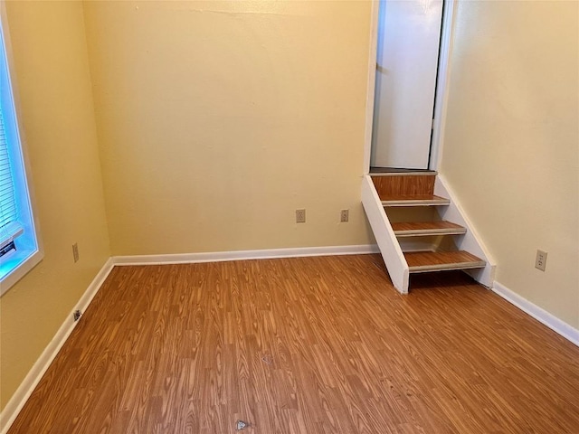 899 Hillyer St Unit 901, San Marcos, TX 78666 - unfurnished room featuring wood finished floors, baseboards, and stairs