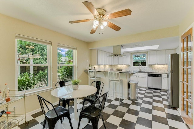 7006 Beckett Rd, Austin, TX 78749 - dining area featuring healthy amount of natural light, dark flooring, and ceiling fan