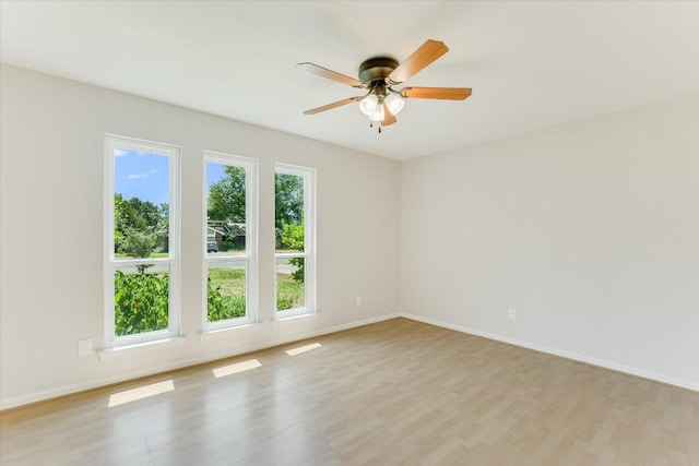 7006 Beckett Rd, Austin, TX 78749 - unfurnished room with light wood-style flooring, ceiling fan, and baseboards