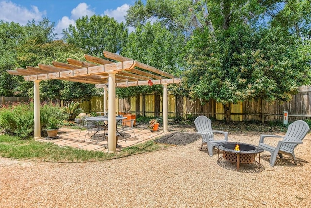 7006 Beckett Rd, Austin, TX 78749 - fenced backyard with a fire pit, a pergola, and a patio area