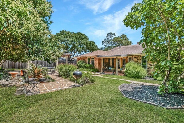 7006 Beckett Rd, Austin, TX 78749 - rear view of property featuring a patio and brick siding
