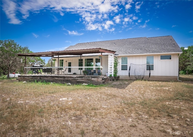 100 Lost Falls Cv, Wimberley, TX 78676 - rear view of house featuring board and batten siding and roof with shingles