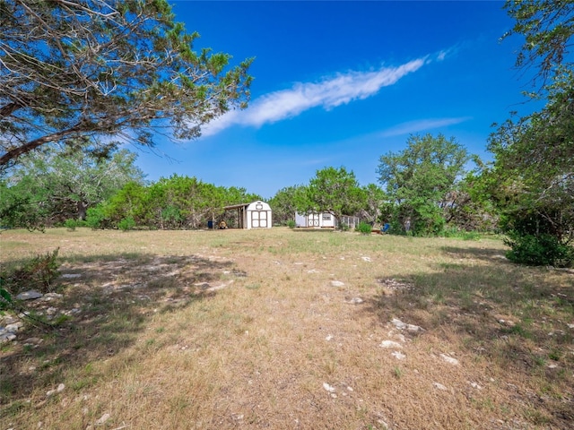 100 Lost Falls Cv, Wimberley, TX 78676 - view of yard featuring a shed