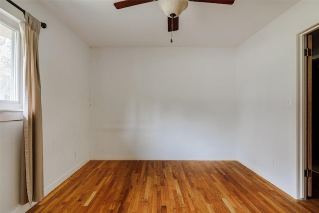 2300 Westworth Cir, Austin, TX 78704 - spare room featuring ceiling fan, wood finished floors, and baseboards