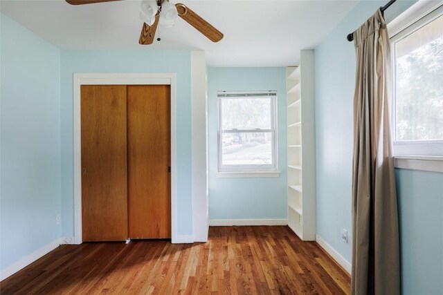 2300 Westworth Cir, Austin, TX 78704 - unfurnished bedroom with wood finished floors, a closet, and a ceiling fan