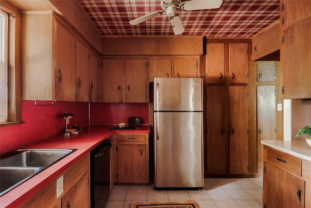 2300 Westworth Cir, Austin, TX 78704 - kitchen featuring freestanding refrigerator, black dishwasher, light tile patterned flooring, and ceiling fan