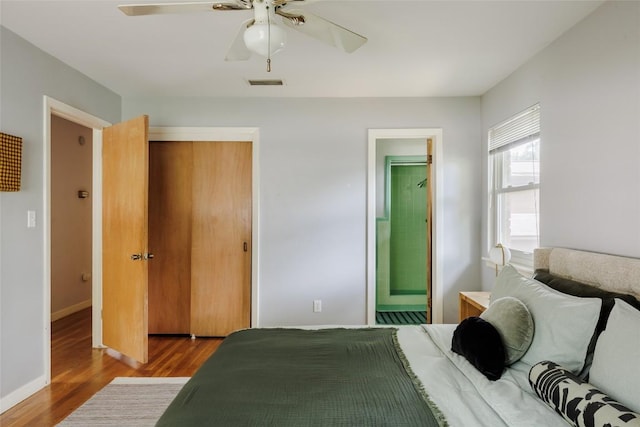 2300 Westworth Cir, Austin, TX 78704 - bedroom with wood finished floors, baseboards, and a ceiling fan