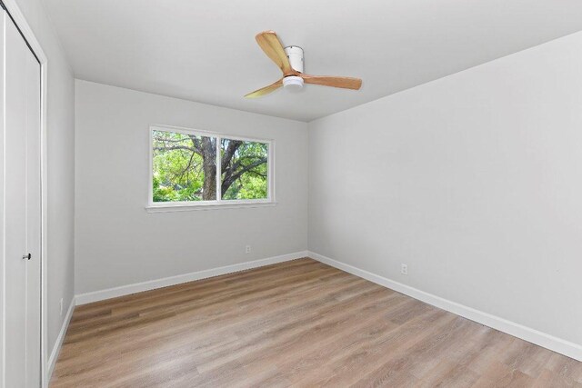7302 Hartnell Dr, Austin, TX 78723 - empty room featuring light wood-style flooring, baseboards, and a ceiling fan