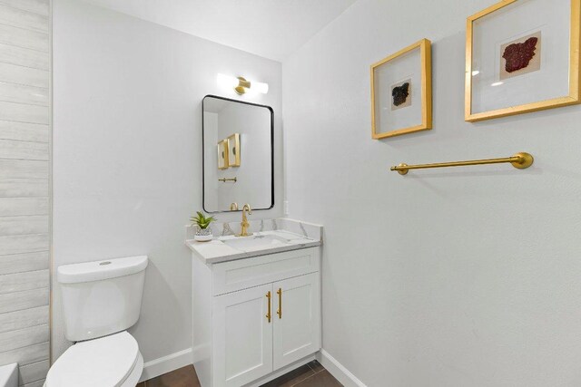 7302 Hartnell Dr, Austin, TX 78723 - bathroom featuring toilet, baseboards, and vanity