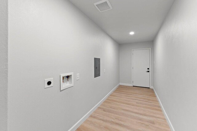 7302 Hartnell Dr, Austin, TX 78723 - laundry room with electric dryer hookup, electric panel, washer hookup, baseboards, and light wood finished floors