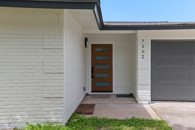 7302 Hartnell Dr, Austin, TX 78723 - entrance to property featuring brick siding and a garage
