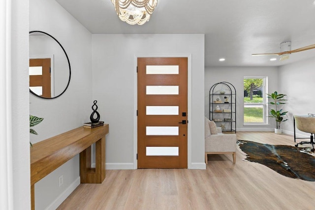 7302 Hartnell Dr, Austin, TX 78723 - entrance foyer featuring wood finished floors, a chandelier, baseboards, and recessed lighting