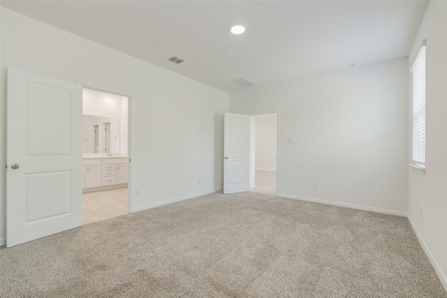 465 Brooks Ranch Dr, Kyle, TX 78640 - unfurnished bedroom with light carpet and connected bathroom