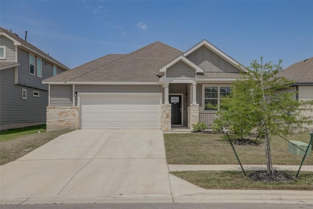 465 Brooks Ranch Dr, Kyle, TX 78640 - craftsman-style house with stone siding, an attached garage, board and batten siding, concrete driveway, and roof with shingles