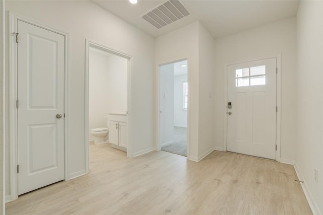 465 Brooks Ranch Dr, Kyle, TX 78640 - foyer entrance with light wood-type flooring and baseboards