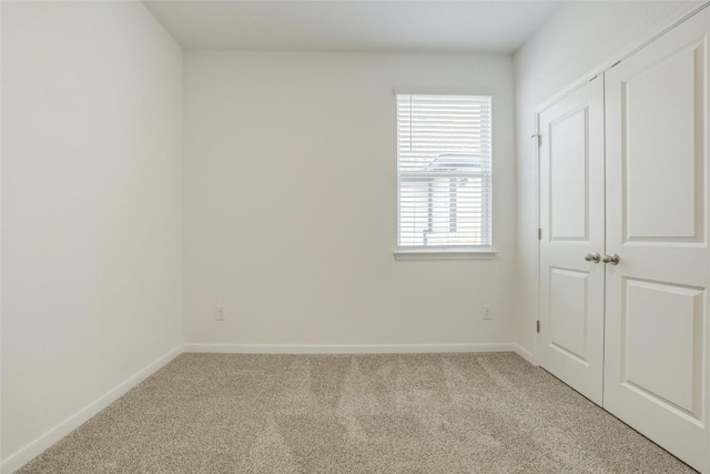 465 Brooks Ranch Dr, Kyle, TX 78640 - unfurnished bedroom featuring light colored carpet and baseboards