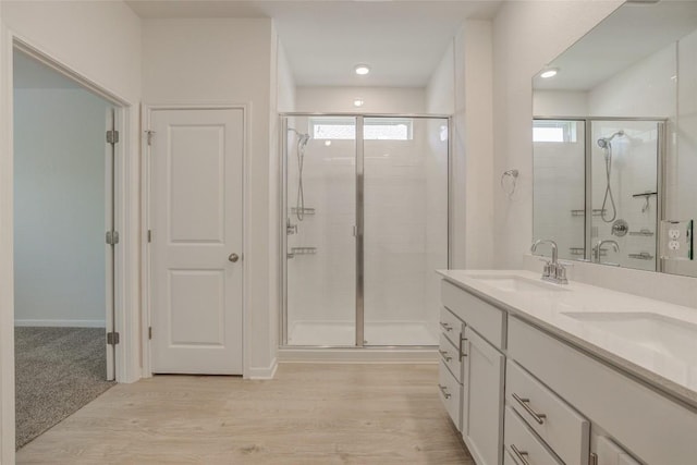 465 Brooks Ranch Dr, Kyle, TX 78640 - full bath featuring a shower stall, double vanity, and wood finished floors