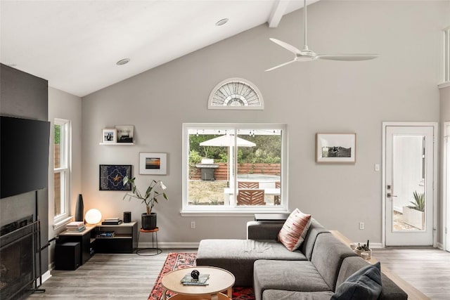 8504 Verona Trl, Austin, TX 78749 - living area with light wood-type flooring, high vaulted ceiling, plenty of natural light, ceiling fan, and beamed ceiling