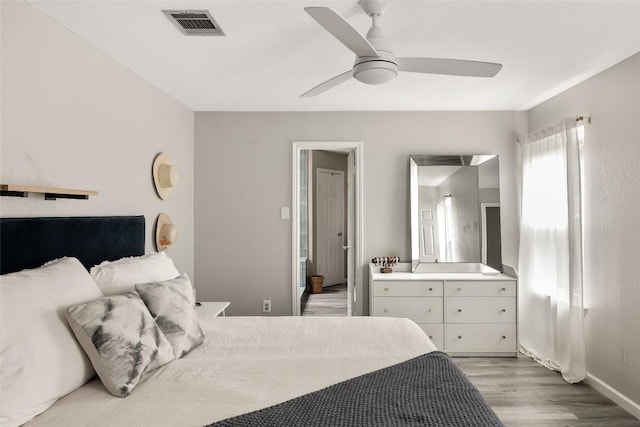 8504 Verona Trl, Austin, TX 78749 - bedroom with wood finished floors and a ceiling fan