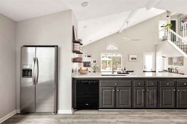8504 Verona Trl, Austin, TX 78749 - kitchen featuring stainless steel refrigerator with ice dispenser, dishwasher, a ceiling fan, light wood-type flooring, and light countertops
