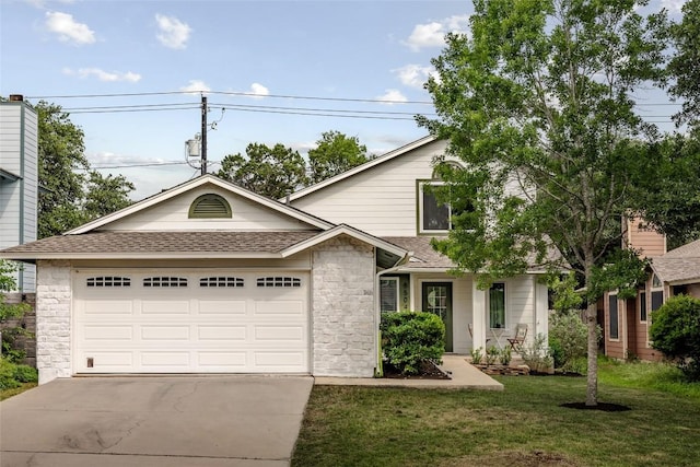 8504 Verona Trl, Austin, TX 78749 - view of front facade with concrete driveway, roof with shingles, an attached garage, stone siding, and a front lawn