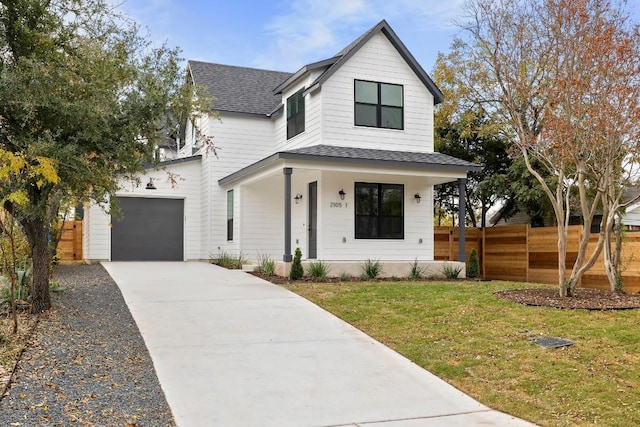 2105 Sl Davis Ave Unit 1, Austin, TX 78702 - modern farmhouse style home with roof with shingles, driveway, and a porch