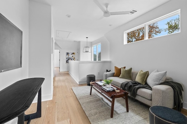2105 Sl Davis Ave Unit 1, Austin, TX 78702 - living area with attic access, light wood finished floors, and a ceiling fan
