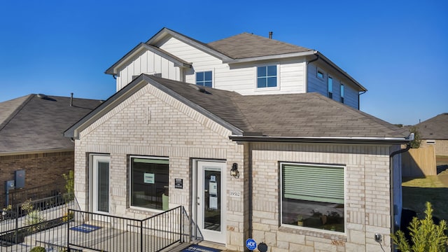 13702 Bothwell Pl, Manor, TX 78653 - view of front facade featuring a shingled roof, brick siding, and stone siding