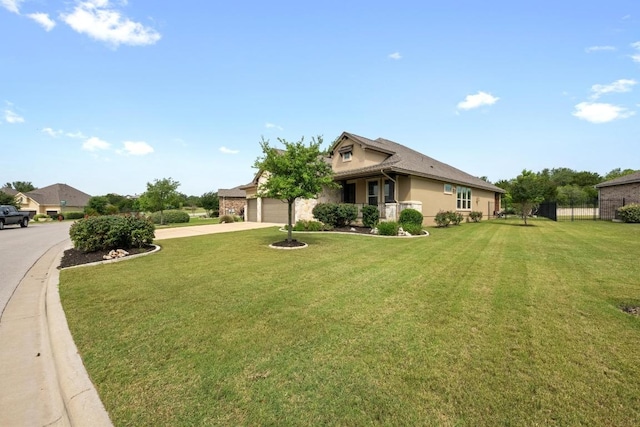 2565 Reunion Blvd, Austin, TX 78737 - view of side of property featuring concrete driveway, an attached garage, and stucco siding