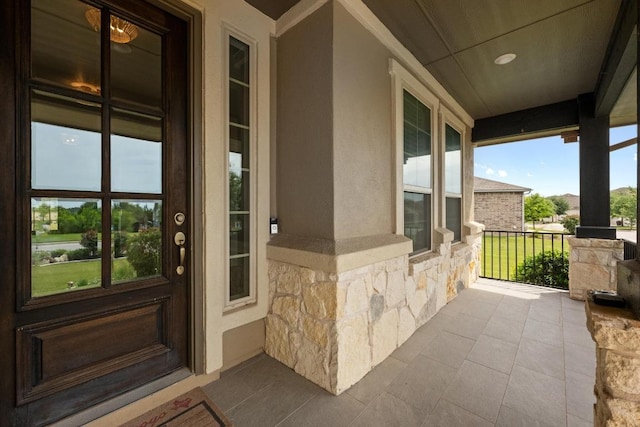 2565 Reunion Blvd, Austin, TX 78737 - property entrance featuring stone siding, stucco siding, and covered porch