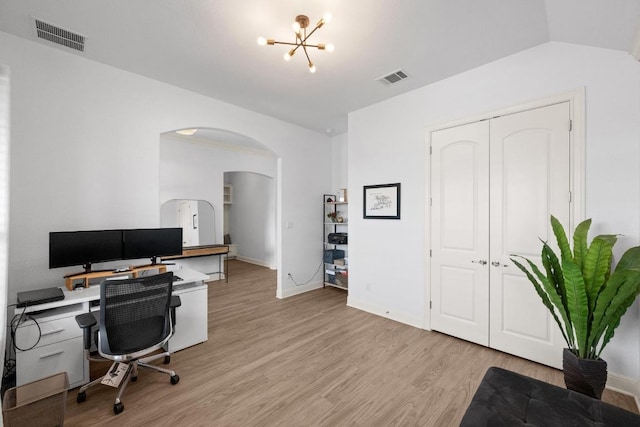 2565 Reunion Blvd, Austin, TX 78737 - office space featuring arched walkways, light wood-style floors, a chandelier, and baseboards