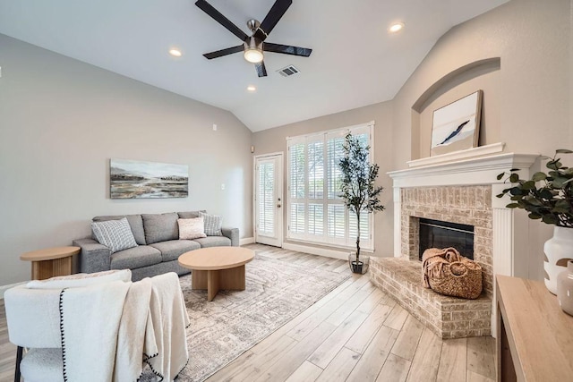 1237 Fall Creek Loop, Cedar Park, TX 78613 - living area featuring ceiling fan, lofted ceiling, wood finished floors, baseboards, and a fireplace