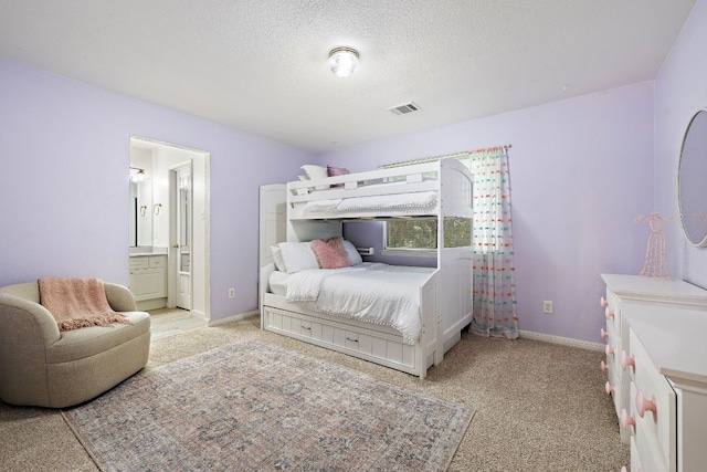1237 Fall Creek Loop, Cedar Park, TX 78613 - bedroom with light carpet, a textured ceiling, ensuite bathroom, and baseboards
