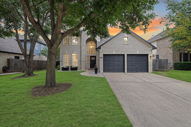 1237 Fall Creek Loop, Cedar Park, TX 78613 - view of front facade featuring an attached garage, concrete driveway, and brick siding