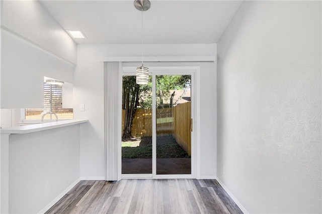 9406 Quail Meadow Dr, Austin, TX 78758 - doorway with wood finished floors and baseboards