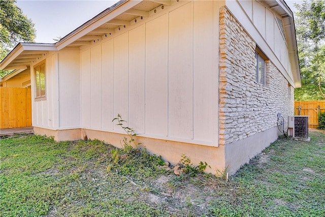 9406 Quail Meadow Dr, Austin, TX 78758 - view of property exterior with stone siding and cooling unit